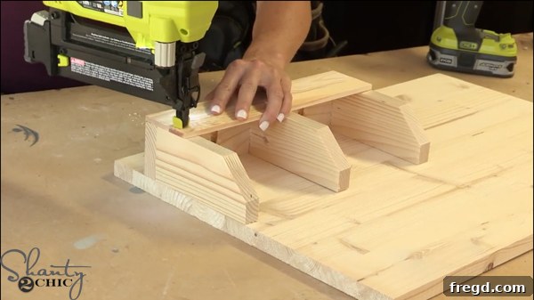 Attaching the mail sorter securely to the craft board using pocket holes or brad nails