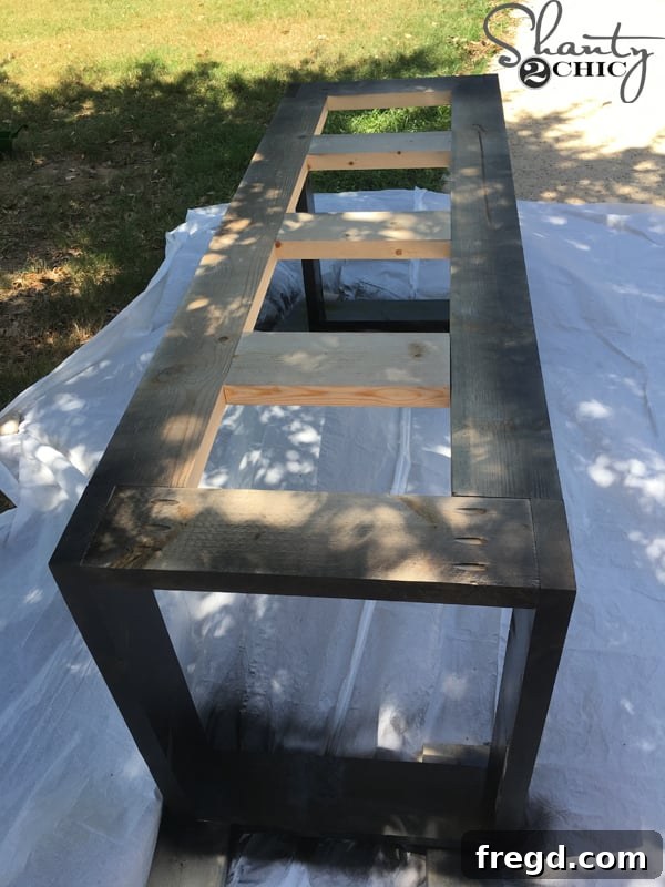 Your Custom Rustic Modern Dining Table 17 Applying Rust-Oleum Metallic Spray Paint to Dining Table Base
