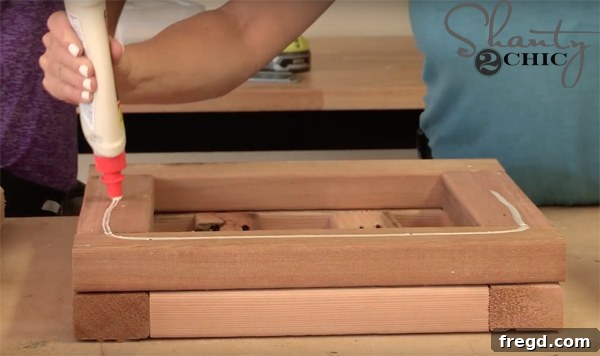 Build a Beautiful Cedar Planter for Under $25: A Complete DIY Guide 9 Applying Wood Glue for the Next Planter Layer