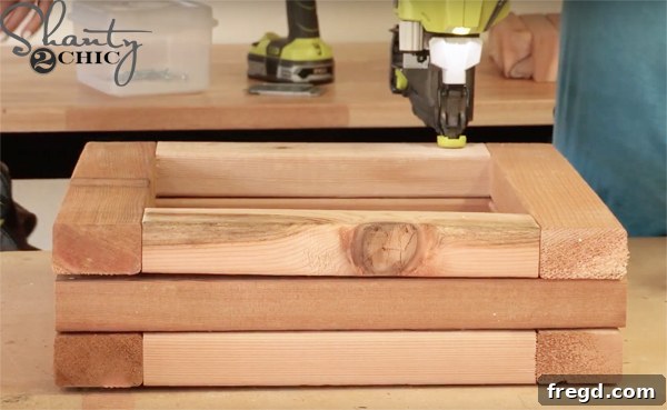 Build a Beautiful Cedar Planter for Under $25: A Complete DIY Guide 10 Nailing the Second Layer of the Cedar Planter