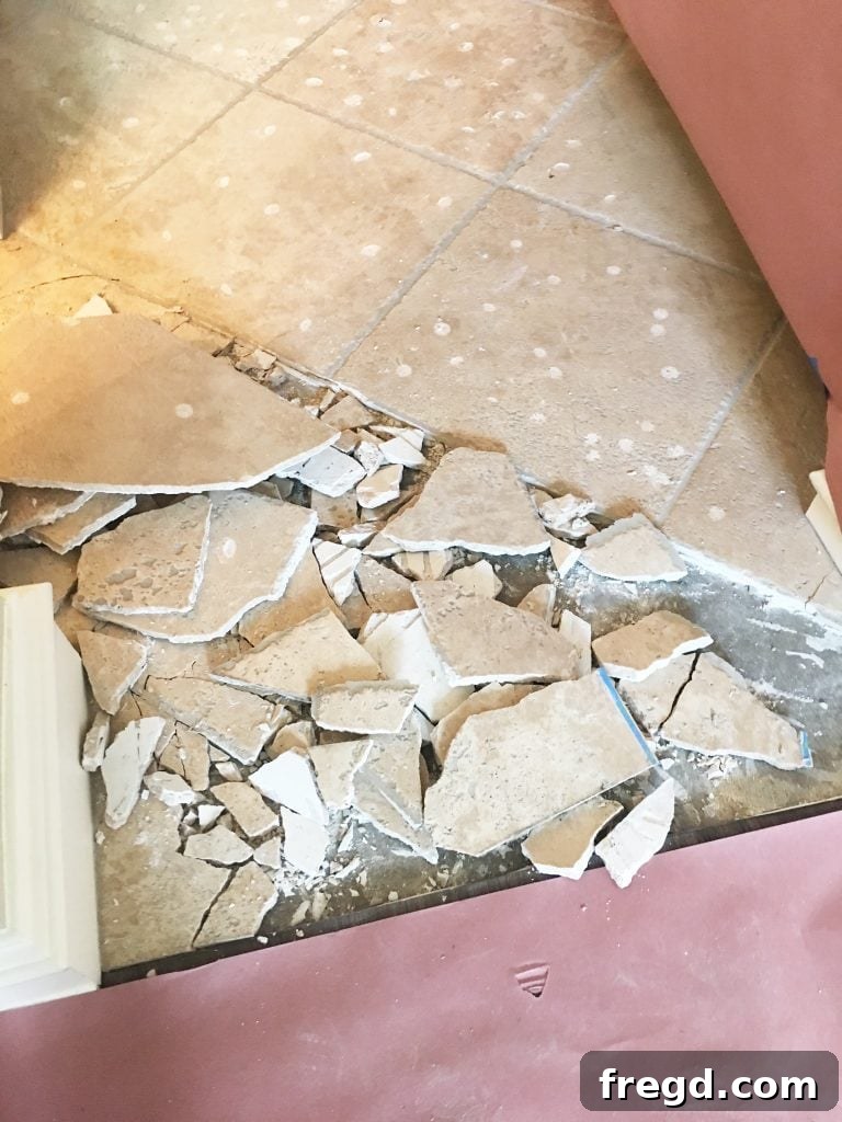 My Kitchen's Laminate Makeover 3 Starting the tile demolition: Preparing the kitchen for new laminate flooring.
