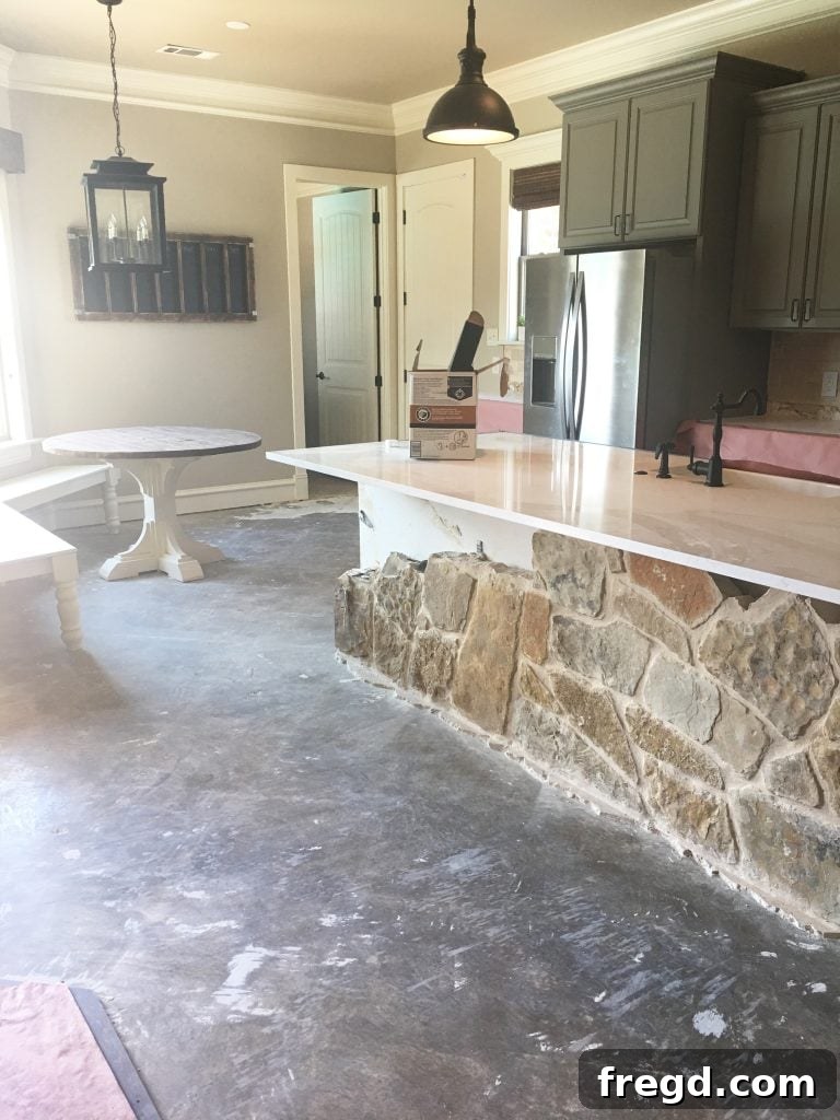My Kitchen's Laminate Makeover 5 Tile completely removed, revealing the prepped concrete subfloor for new flooring.