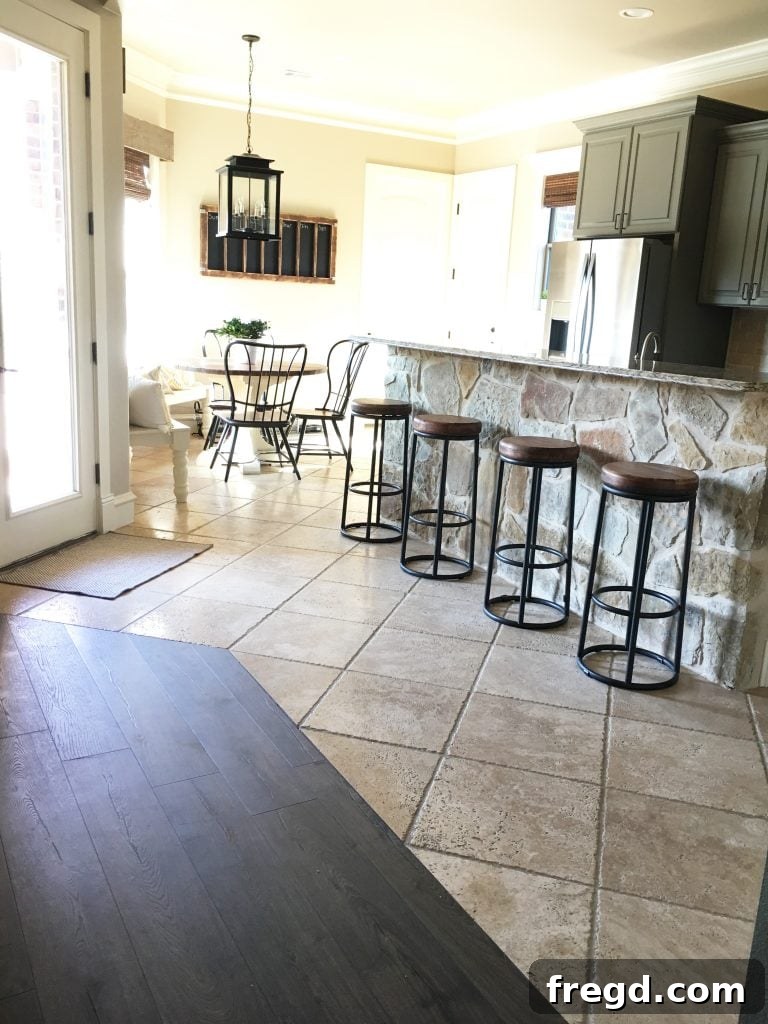 My Kitchen's Laminate Makeover 8 Before: Tiled kitchen floor creating a segmented look in the open space.