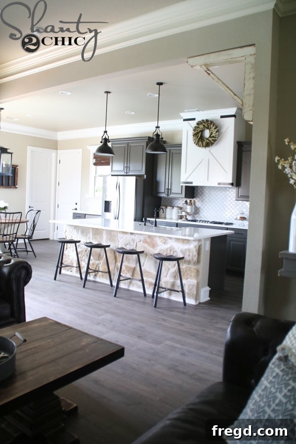 My Kitchen's Laminate Makeover 9 After: Kitchen with new Quick-Step Maison Oak laminate, creating seamless flow.