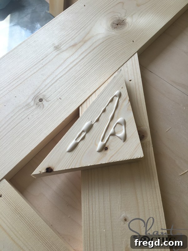 Rustic Glide Media Hub 31 applying-wood-glue-to-top-corner-pattern-cuts
