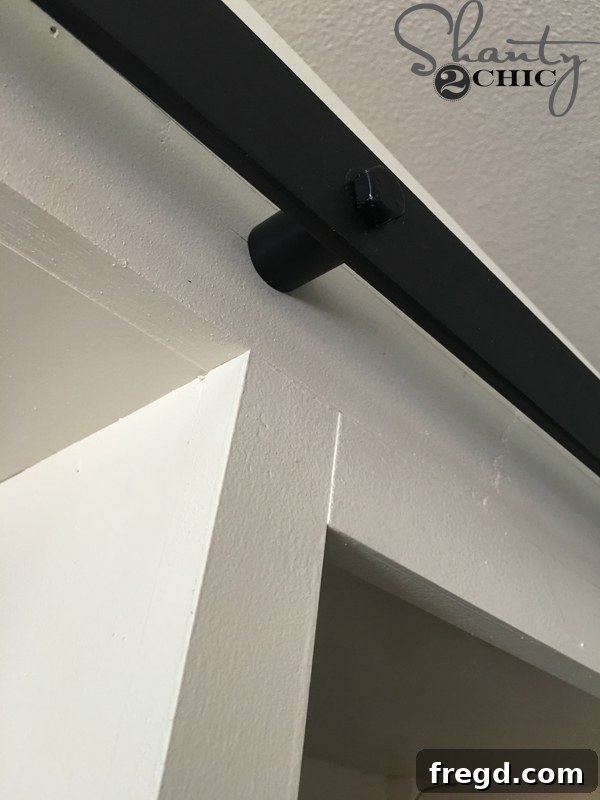 Rustic Glide Media Hub 47 close-up-of-barn-door-track-bolt-installation
