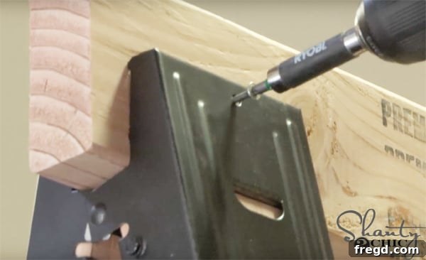 Weekend Build: Sawhorse Bookcase with Video Instructions 11 Securing the top board with Spax screws