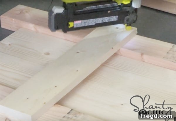 Weekend Build: Sawhorse Bookcase with Video Instructions 6 Attaching ladder rungs with wood glue and brad nails