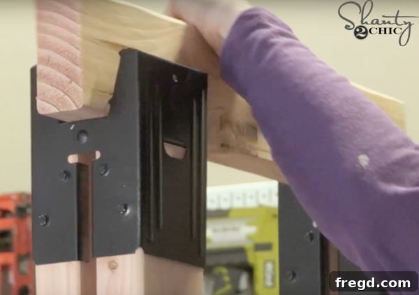 Weekend Build: Sawhorse Bookcase with Video Instructions 10 Placing the top board into the sawhorse brackets