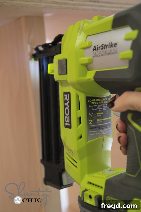 Close-up of an 18-Volt Brad Nailer, a key tool for fast assembly