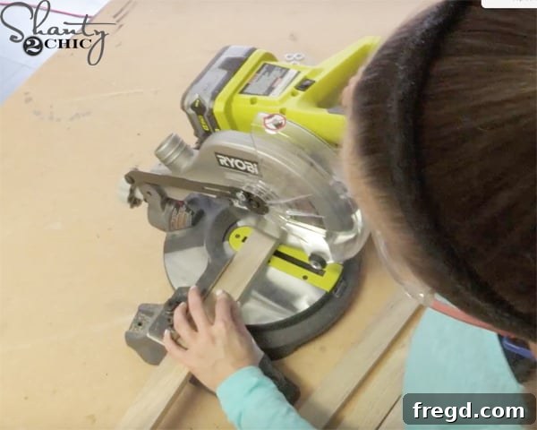 Wood pieces being cut on an 18-Volt Miter Saw for the blanket ladder project