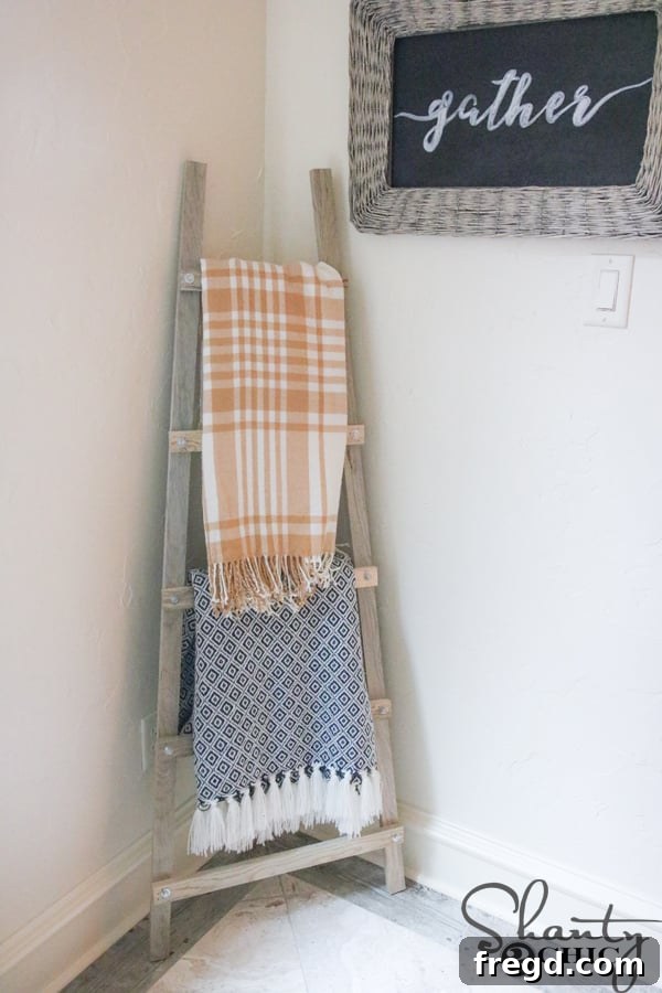 Close-up of a hex screw and washer being installed onto a blanket ladder rung with a drill