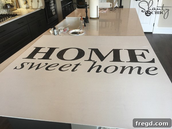 Carefully painting letters onto the sign with a brush.