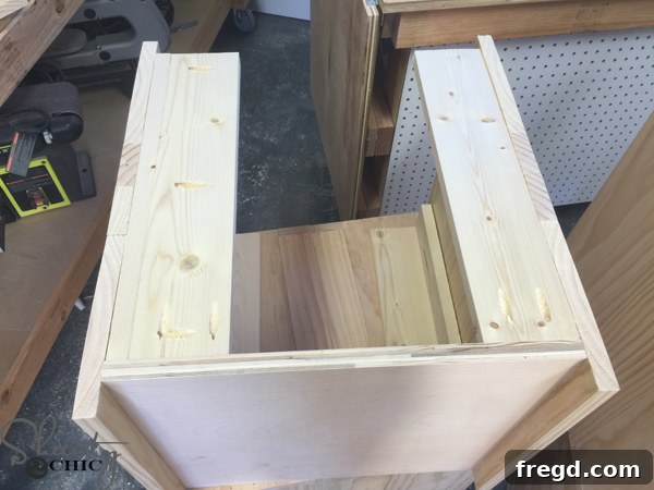 Build Your Own Rolling Storage Ottoman Coffee Table 13 Planks being securely attached to the second side of the ottoman, maintaining the same pattern and flush alignment as the first side.