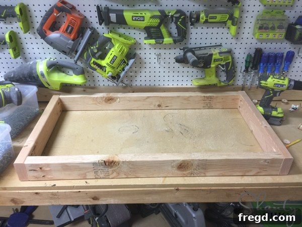 Build Your Own Rolling Storage Ottoman Coffee Table 19 A single, longer wooden piece that serves as the main central component for the coffee table base.