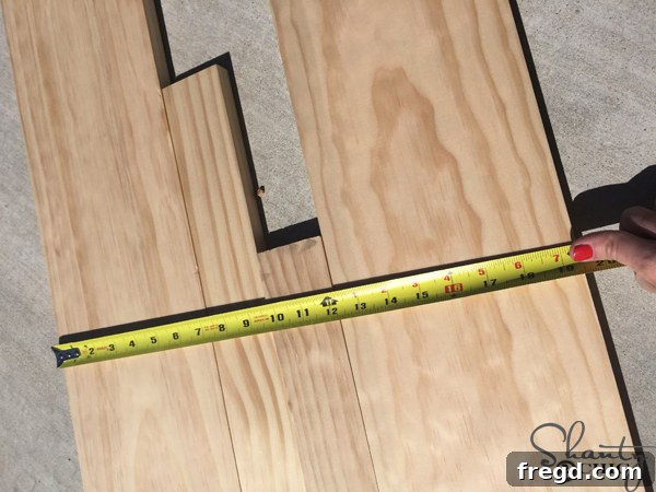 Build Your Own Rolling Storage Ottoman Coffee Table 3 Detailed view of the coffee table with ottomans partially pulled out, showcasing their rolling functionality and integrated design.