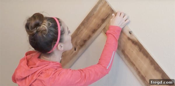 Stunning DIY Barnwood Herringbone Accent Wall 3 A selection of faded gray and brown face-planed barn wood, showcasing the ideal choice for a rustic herringbone wall project.