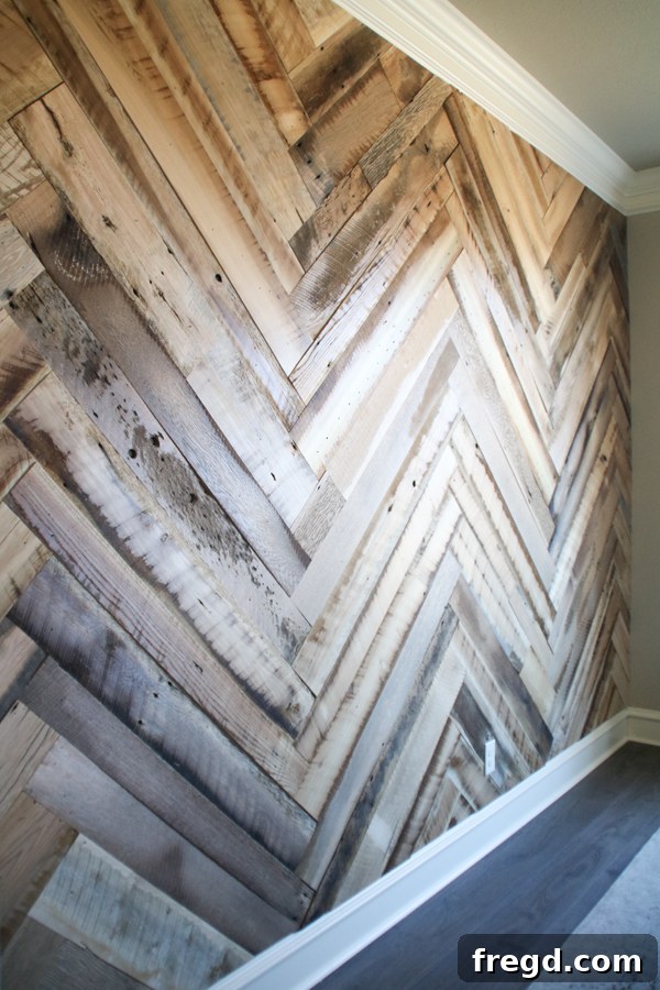 Stunning DIY Barnwood Herringbone Accent Wall 4 Close-up of the chosen Faded Gray/Brown Face Planed Barn Wood, highlighting its subtle color variations and smooth finish, ready for installation.