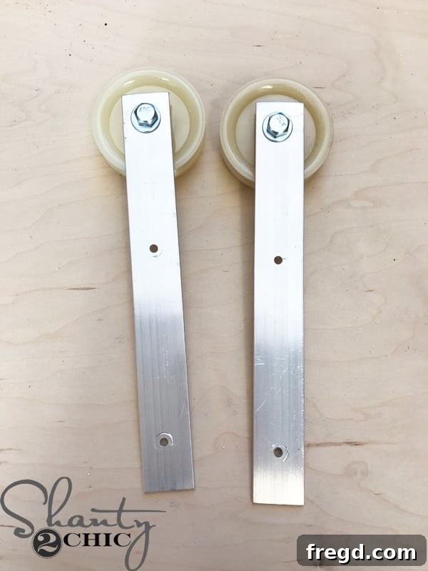 Make Your Own Barn Door Hardware for Just $20 14 Predrilling holes in the aluminum flat bar