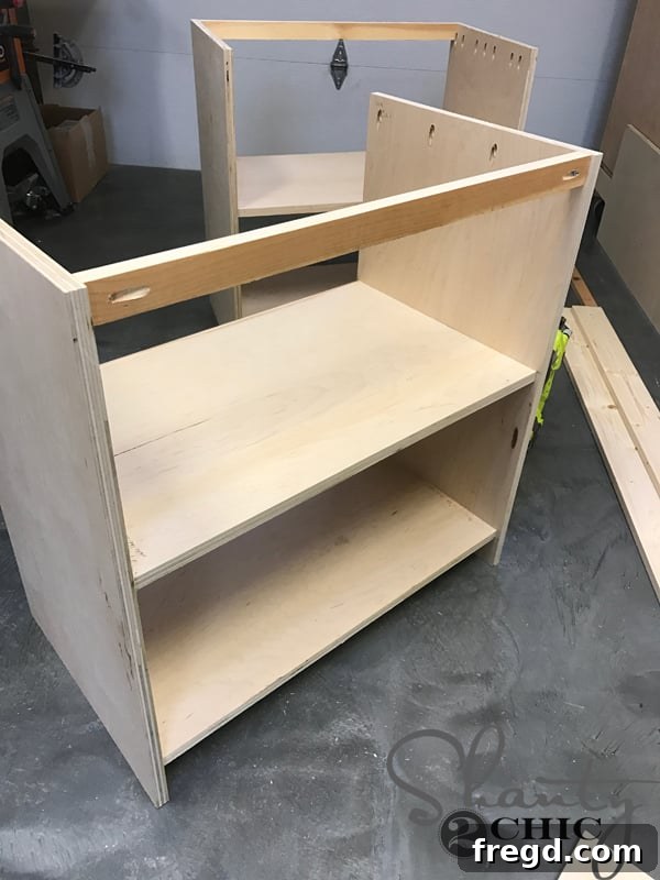Craft Your Own Sliding Barn Door Nightstand 13 Attaching the top back support piece to the nightstand frame