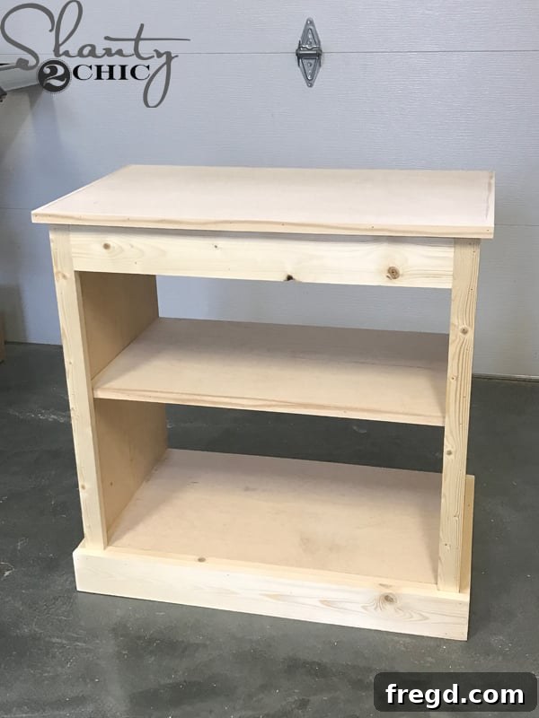 Craft Your Own Sliding Barn Door Nightstand 23 Attaching the front top trim to the nightstand, completing the top edge