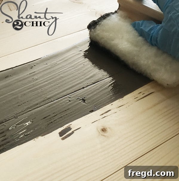Craft Your Own Sliding Barn Door Nightstand 27 Nightstand being stained with Briarsmoke by Varathane