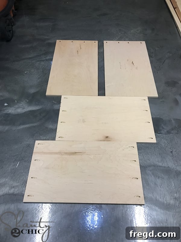 Craft Your Own Sliding Barn Door Nightstand 5 Prepared plywood pieces for nightstand construction, including sides, top, bottom, and shelf