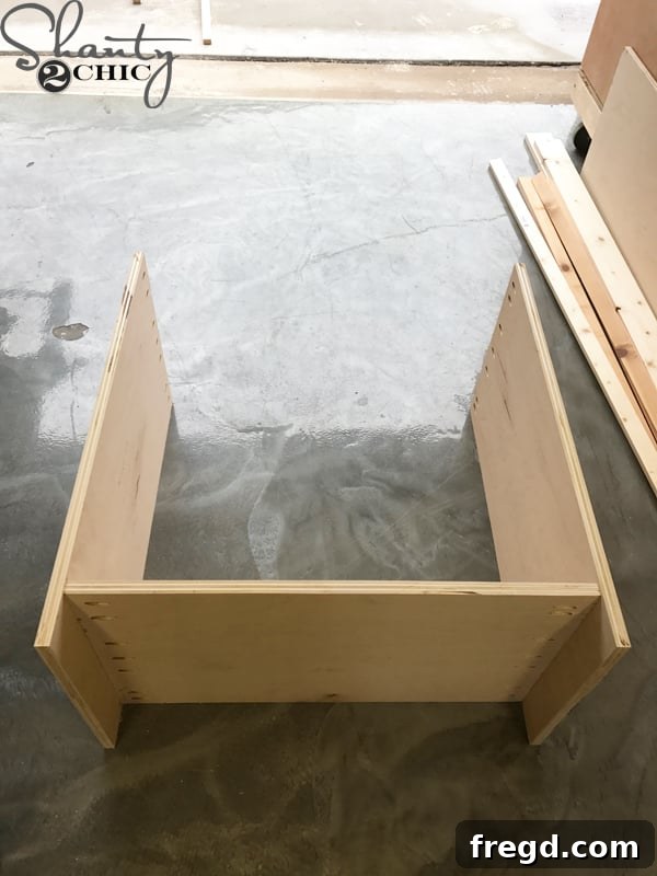 Craft Your Own Sliding Barn Door Nightstand 8 Partially assembled nightstand cabinet showing the joined side and bottom panels
