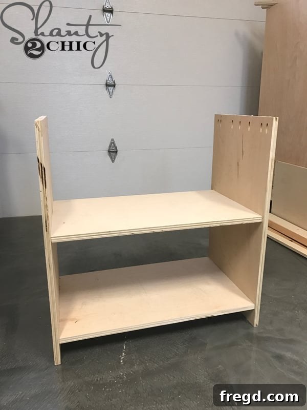 Craft Your Own Sliding Barn Door Nightstand 10 Front view of the nightstand frame with the interior shelf installed