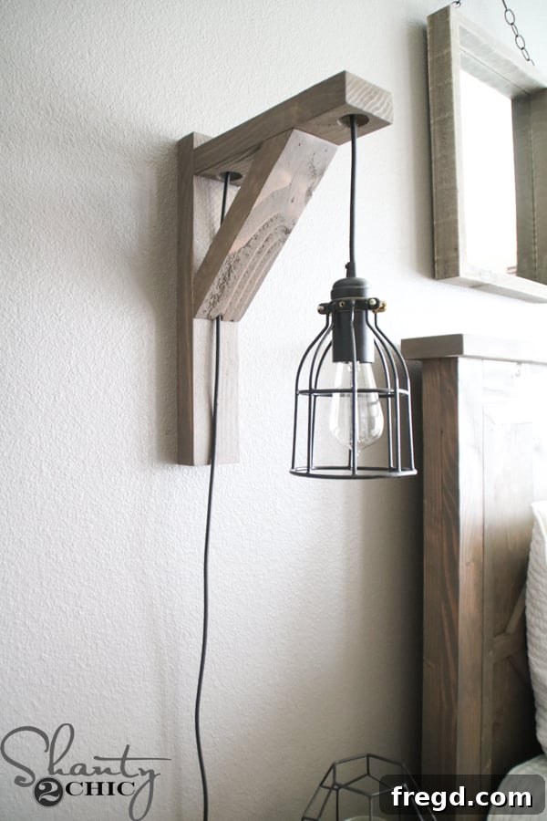 Build Your Own Corbel Sconce for Just $25 7 The finished DIY Corbel Sconce Light mounted on a bedroom wall, providing rustic charm.