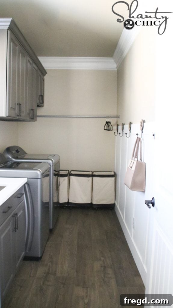 Ultimate Laundry Room Makeover 2 Before shot of the laundry room showing existing floor and wall