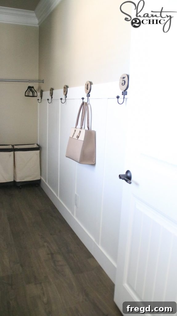 Ultimate Laundry Room Makeover 13 Finished board and batten wall after filling, sanding, and painting
