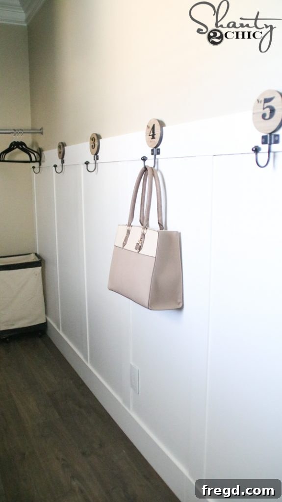 Laundry room showing washer and dryer area with new flooring