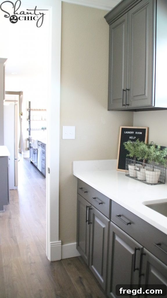 Another angle highlighting the flow from kitchen to laundry room