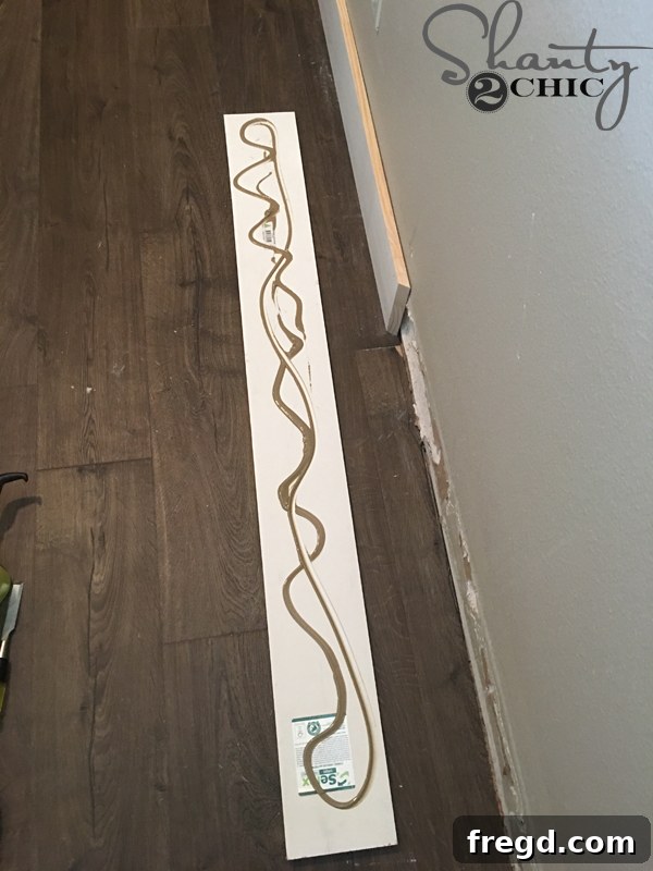 Ultimate Laundry Room Makeover 6 Two MDF boards joined with a miter cut for seamless baseboard
