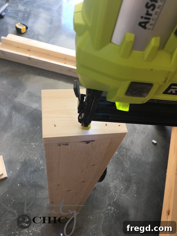 Kitchen Upgrade: DIY Floating Dish Shelf Tutorial 22 Attaching side pieces to the shelf with wood glue and brad nails