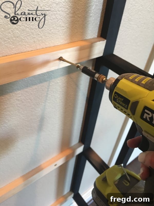 Kitchen Upgrade: DIY Floating Dish Shelf Tutorial 25 Marking wall studs for secure installation of the plate rack frame