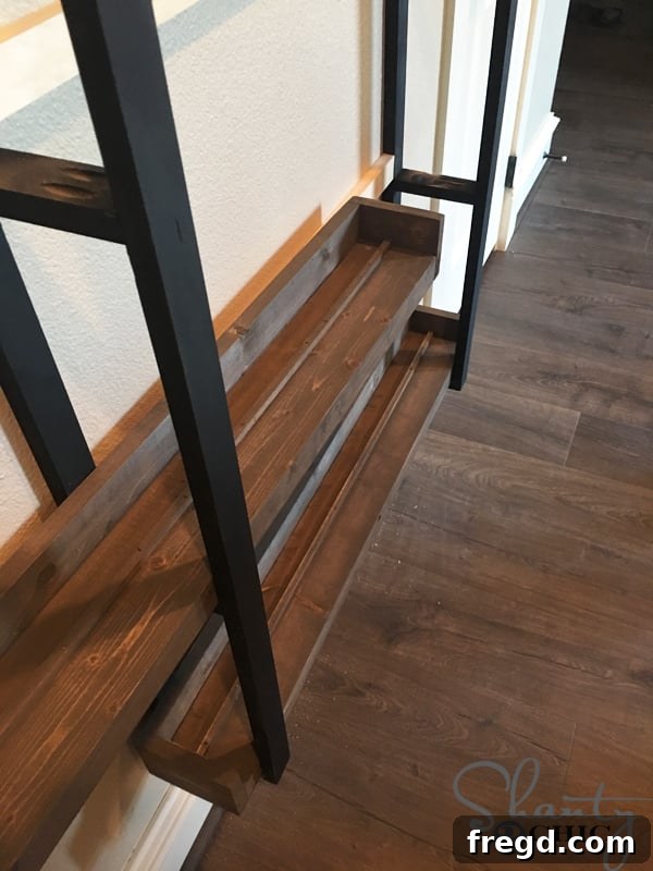 Kitchen Upgrade: DIY Floating Dish Shelf Tutorial 26 Attaching the ladder frame to wall studs using long wood screws through cleats