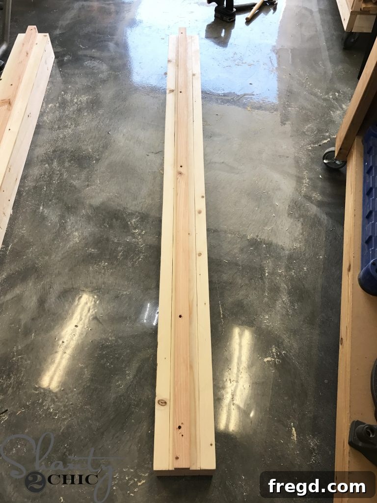 Completed side panel of the DIY outdoor lounge chair with a 2x2 cleat securely attached to the interior, ready for the next assembly phase.