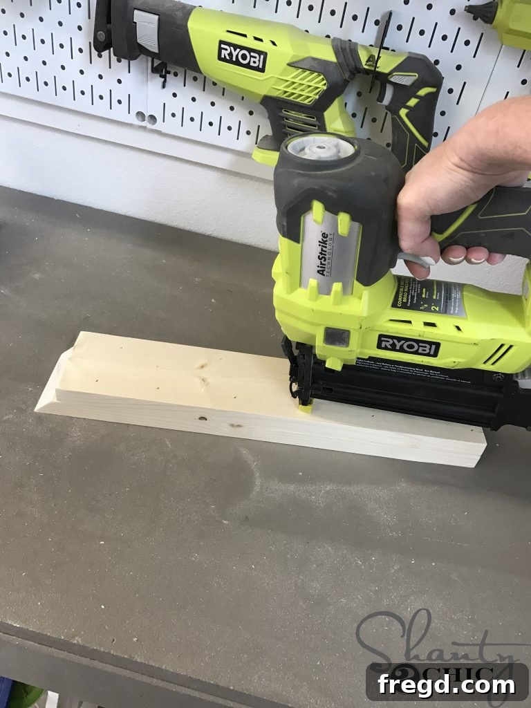 Building the adjustable arm for the backrest guide using a nailer and wood glue, creating a robust component for the lounge chair mechanism.