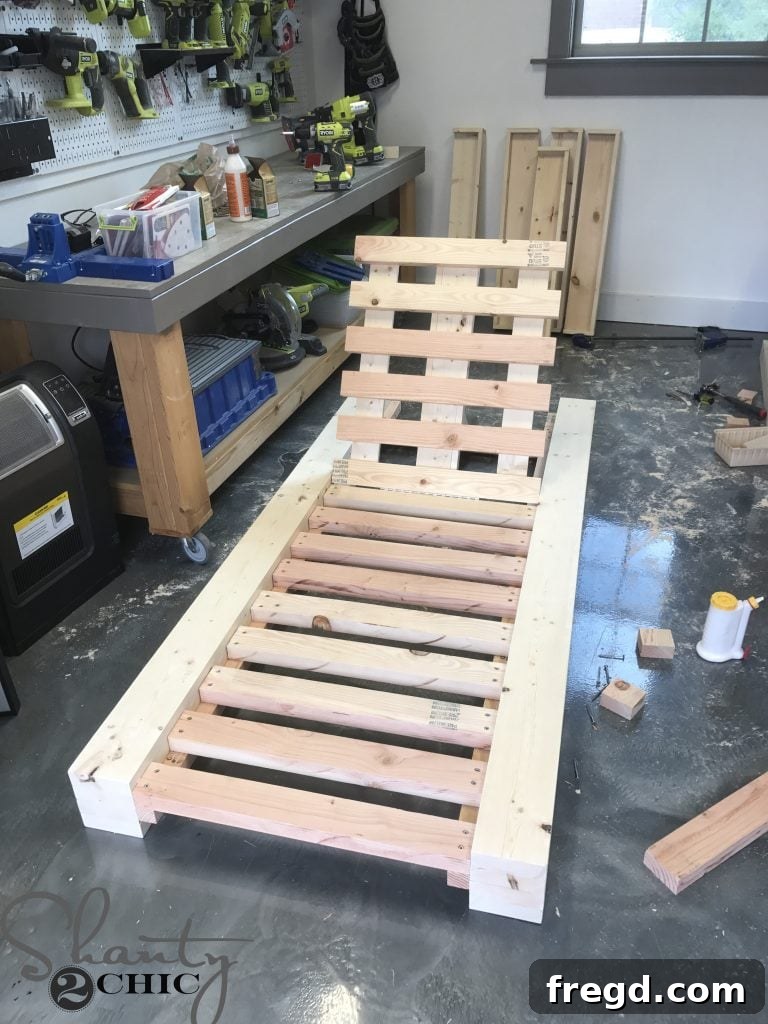 A beautifully completed DIY Outdoor Lounge Chair, showcasing its robust construction and ready for cushions and relaxation.