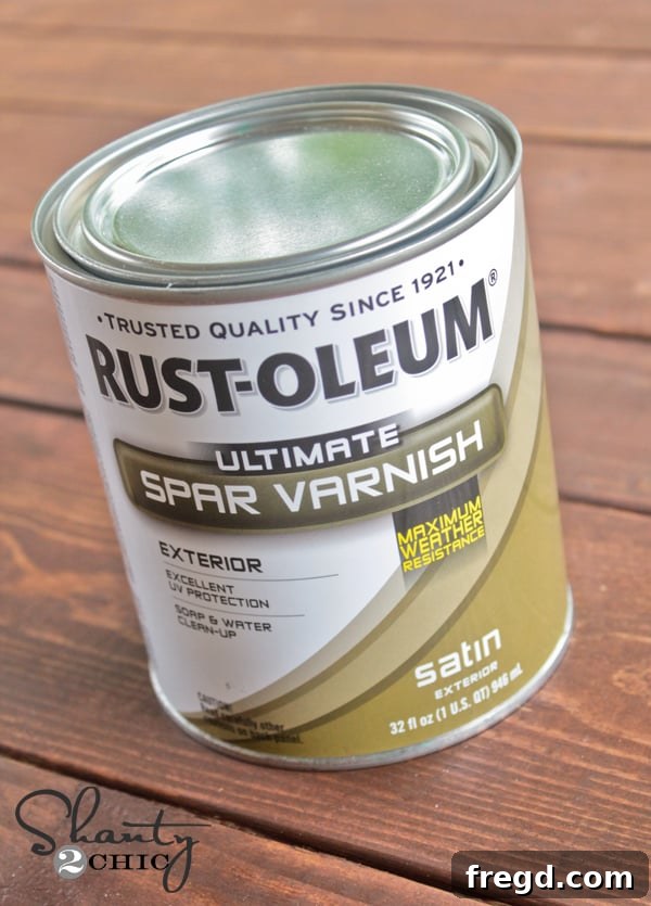 Applying Spar Varnish by Rustoleum to a DIY lounge chair, ensuring maximum protection against harsh outdoor elements and extending its lifespan.