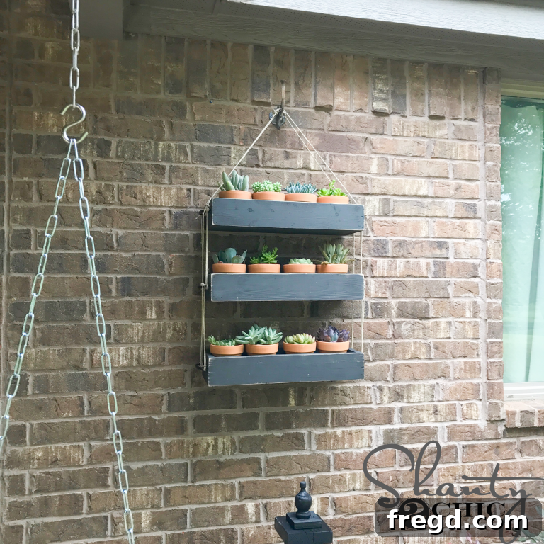 Elevate Your Greenery: DIY Hanging Planter Project 11 Close-up of DIY Hanging Planter showcasing potted succulents and rustic charm