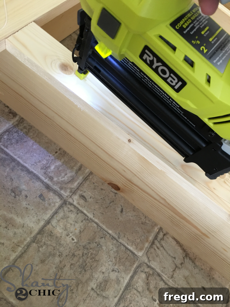 Securing Frame Support to Dividers with Brad Nails