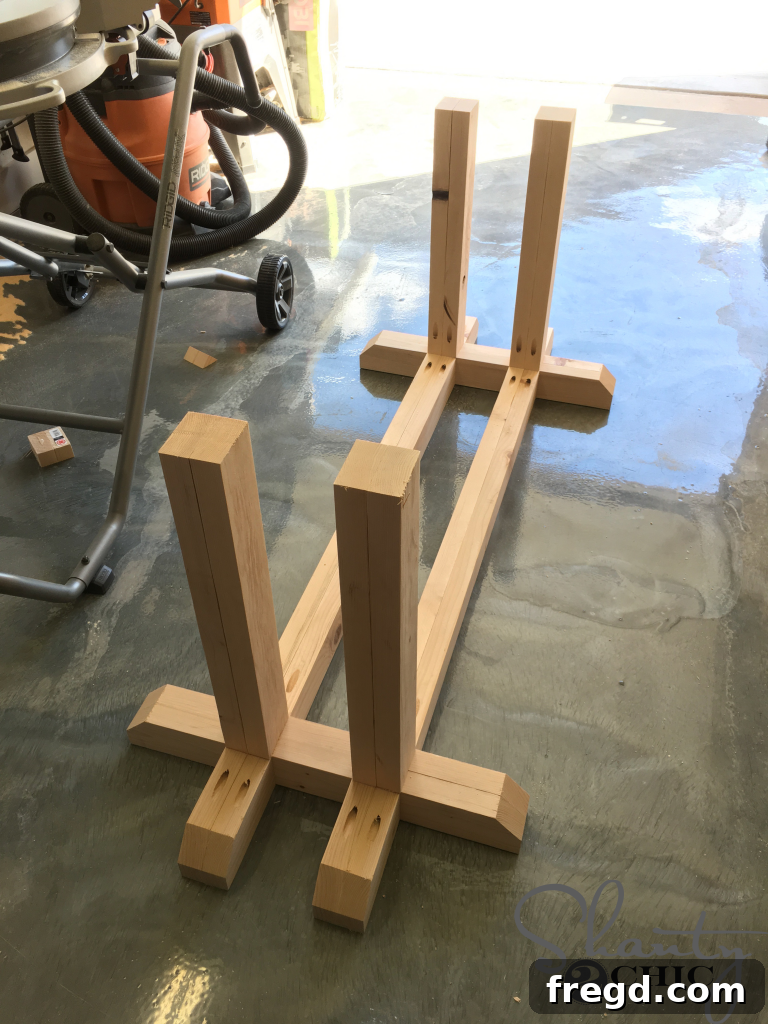 Attaching the Legs to the Bottom of the Table base for stability.