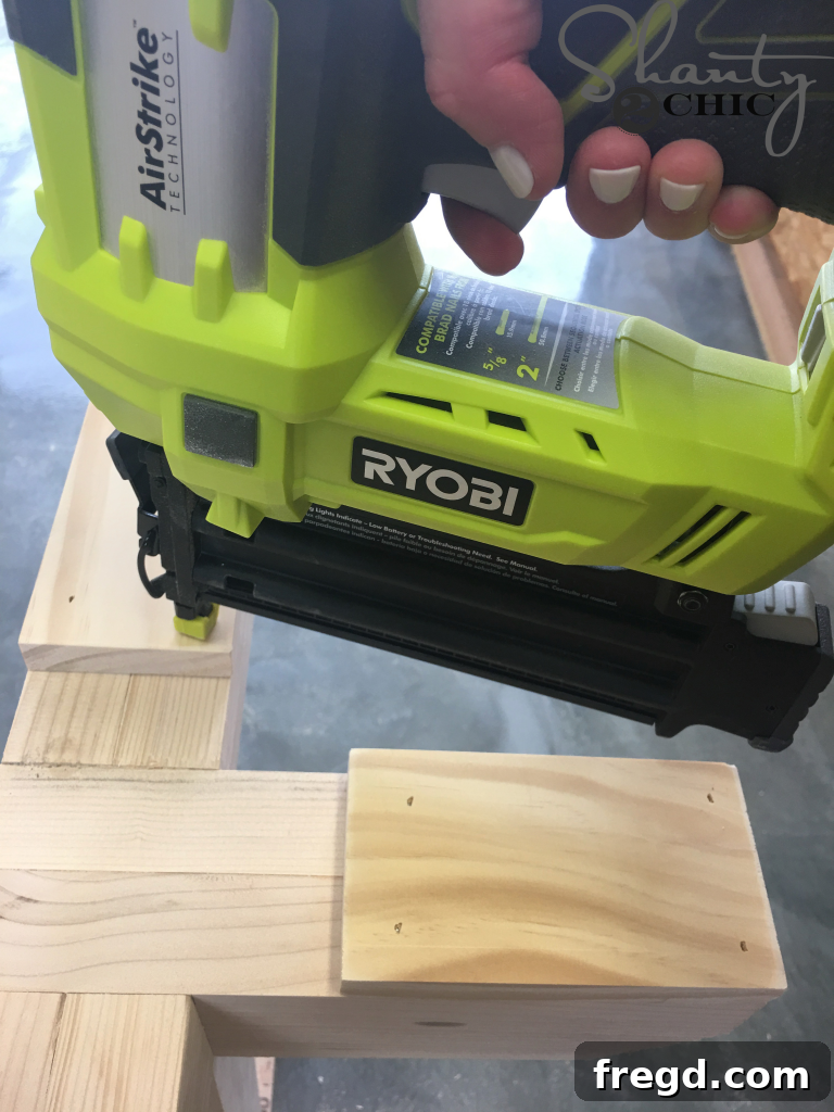 Attaching the Foot Pads to the bottom of the table legs for floor protection.