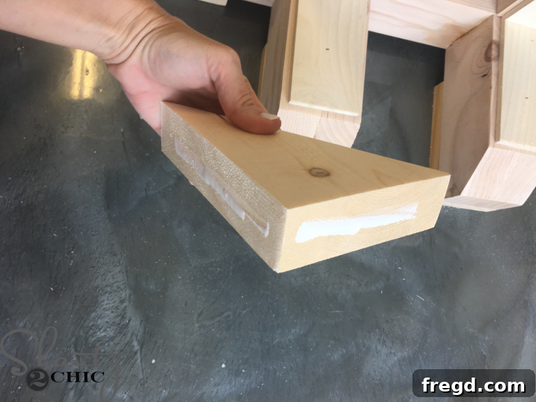 Applying Wood Glue to the Corbels for secure attachment to the table base.