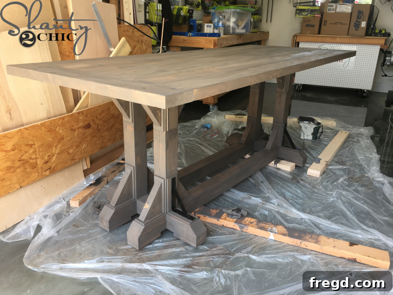 DIY Industrial Corbel Farmhouse Table stained with Varathane Briarsmoke.