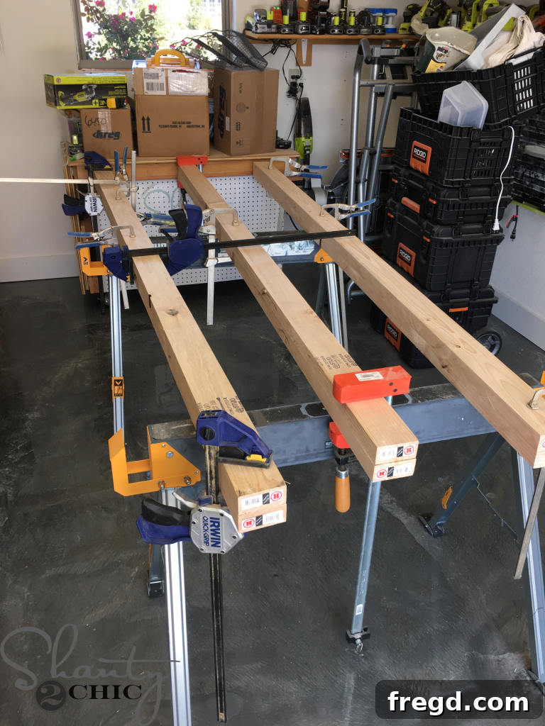 Clamping laminated boards overnight for a strong, secure bond in DIY table construction.
