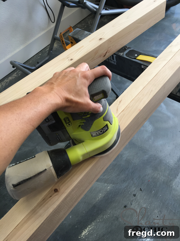 Sanding Pine wood after laminating for a perfectly smooth table leg surface.